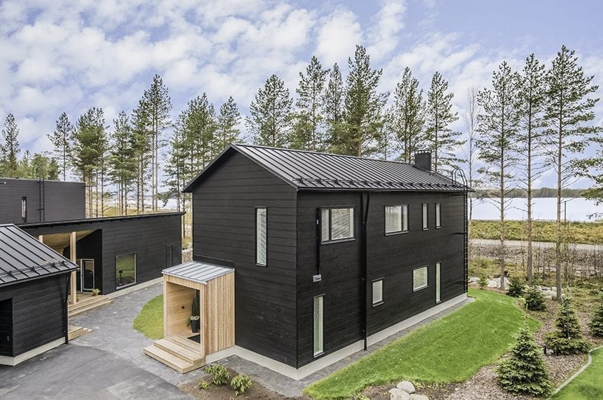 Honka Markki. A modern log home with a lake view.